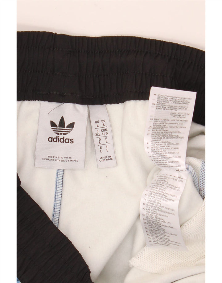 Męskie spodnie wiatrówkowe Adidas Adventure, duże, niebieskie, poliestrowe w cętki