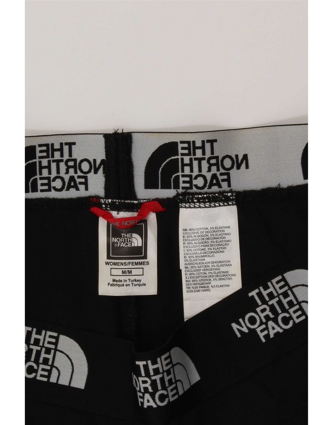 Damskie legginsy graficzne The North Face UK 14, średnie czarne, bawełniane