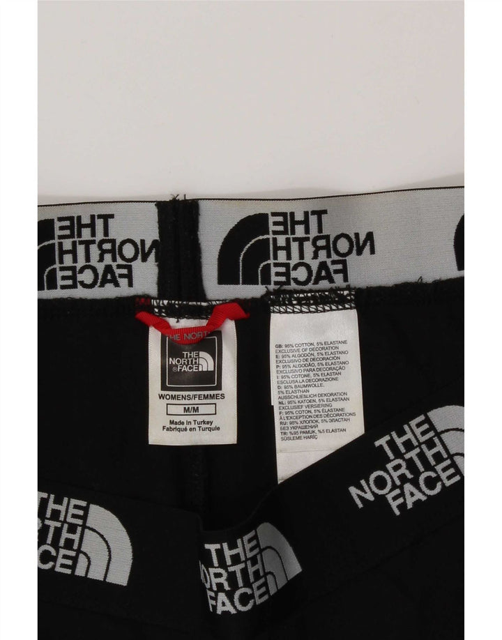Damskie legginsy graficzne The North Face UK 14, średnie czarne, bawełniane