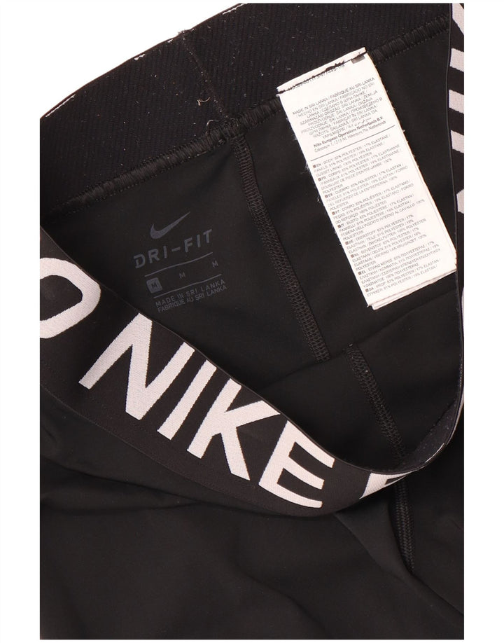 Damskie legginsy Nike Dri Fit Graphic Capri UK 12, średni czarny poliester