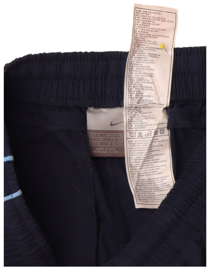 Męskie spodnie dresowe Nike Graphic Capri, średni granat, blok kolorów
