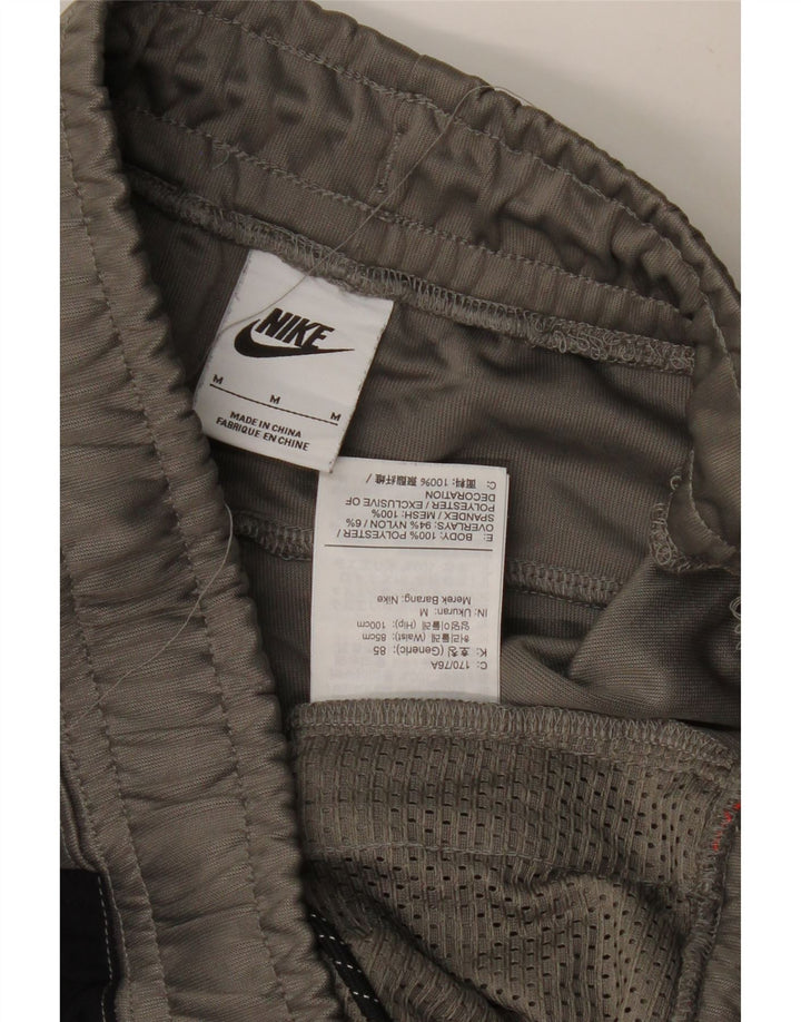 Męskie spodnie dresowe NIKE Joggery Średnioszary poliester w blokach kolorów