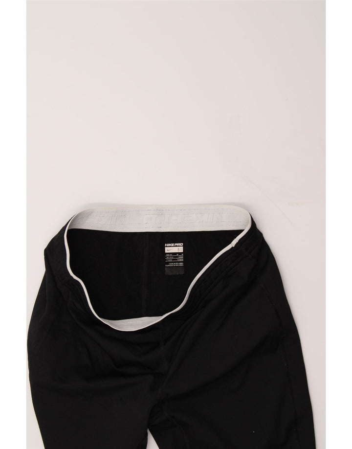 NIKE Womens Tracksuit Trousers UK 12/14 Medium  Black Polyester Vintage Nike and Second-Hand Nike from Messina Hembry 