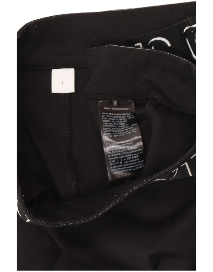 Damskie spodnie CALVIN KLEIN o kroju slim fit z grafiką, duże W32 L27 czarne