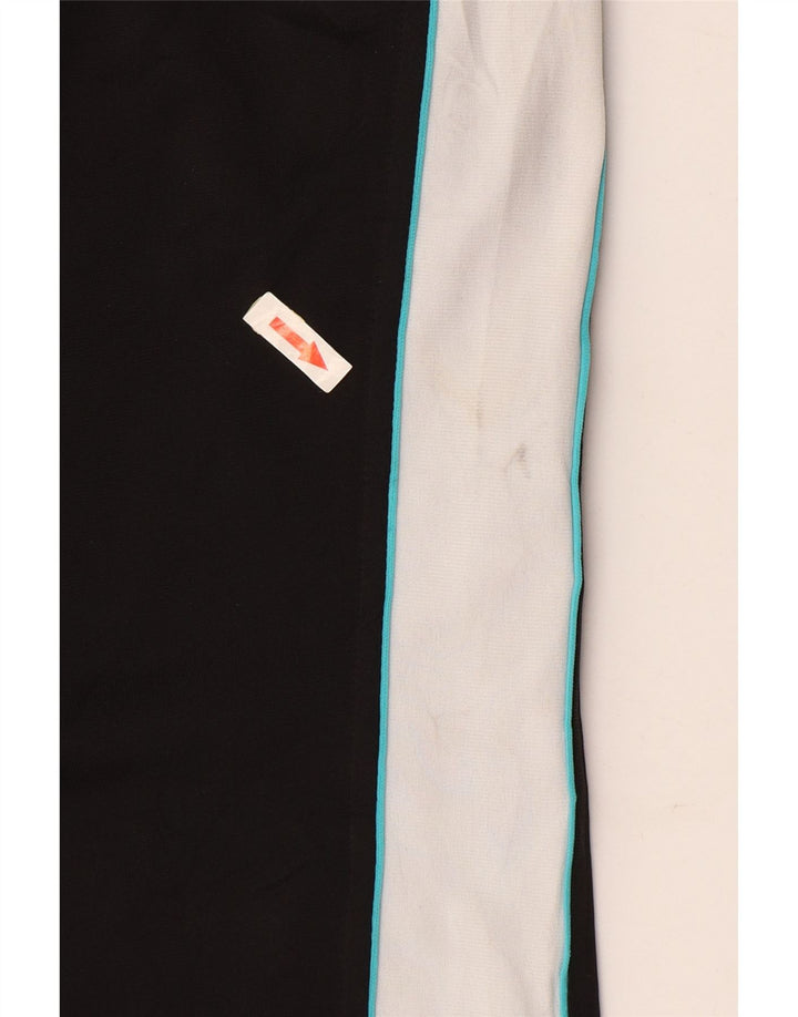 Damskie spodnie dresowe PUMA UK 14, duży czarny poliester z blokami kolorów