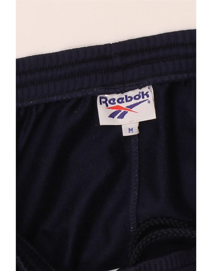 REEBOK Mens Tracksuit Trousers Medium Navy Blue Polyester Vintage Reebok and Second-Hand Reebok from Messina Hembry 