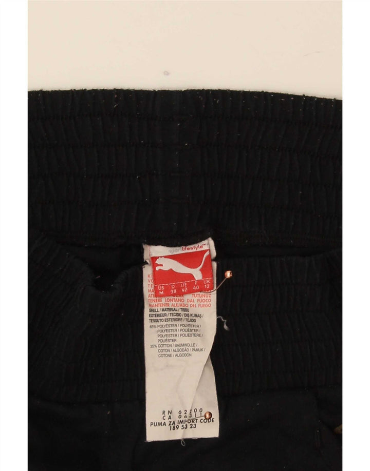 Damskie spodnie dresowe Puma Capri Joggers UK 12 Średni czarny poliester
