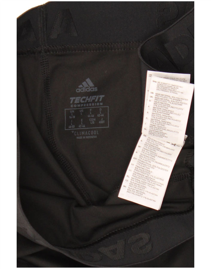 Damskie legginsy Adidas Tech Fit Capri UK 16/18, duże, czarne, poliestrowe
