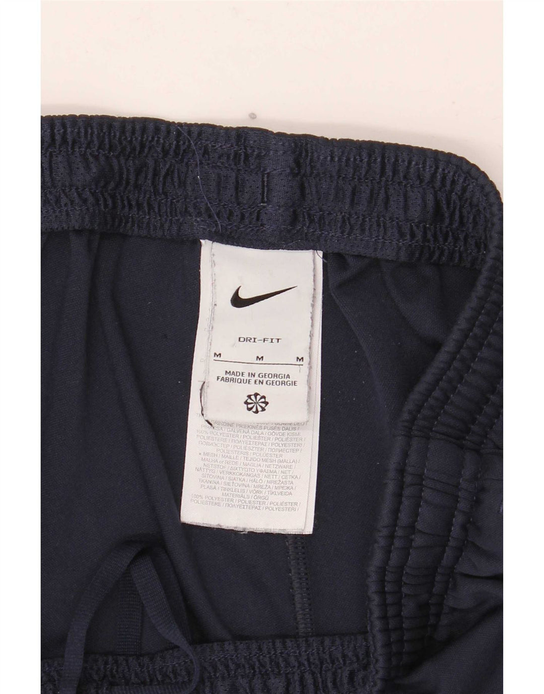 Męskie spodnie dresowe Nike Dri Fit, poliester w kolorze średniego granatu, w blokach kolorów