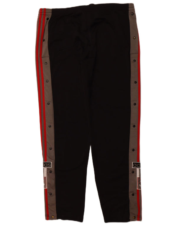 Damskie spodnie dresowe ADIDAS z grafiką, duże, czarne, sportowe z blokami kolorów