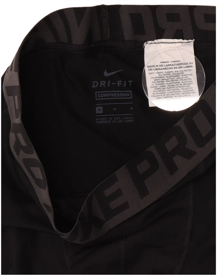 Chłopięce legginsy Nike Compression Graphic 10-11 lat, średni czarny poliester