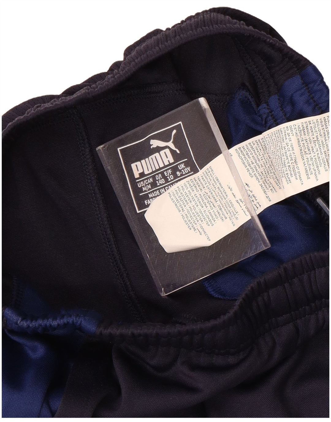 Chłopięce spodnie dresowe PUMA 9-10 lat, granatowy poliester z blokami kolorów