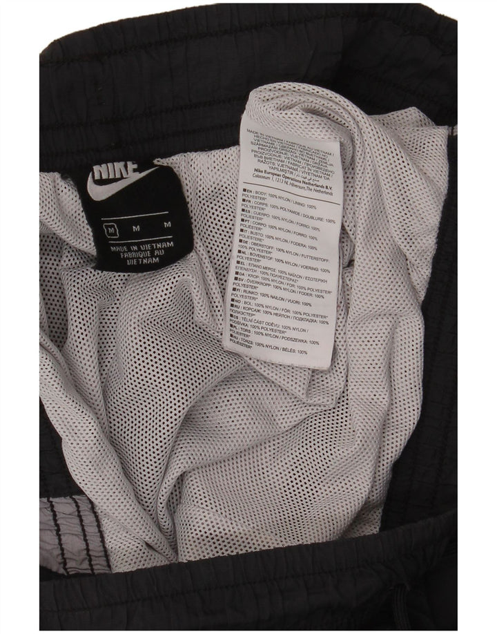 Męskie spodnie dresowe Nike Joggers Średnioszary poliamid z blokami kolorów