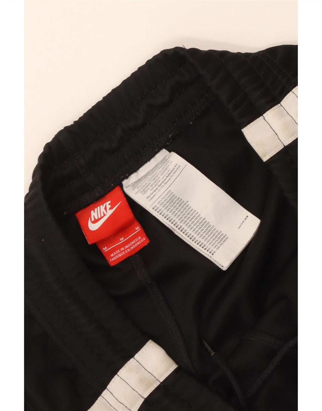 Męskie spodnie dresowe Nike Joggers, poliester w kolorze średniej czerni