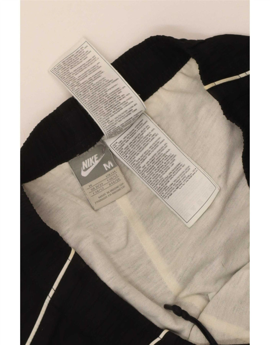 Męskie spodnie dresowe Nike Graphic, joggery, średni czarny poliester