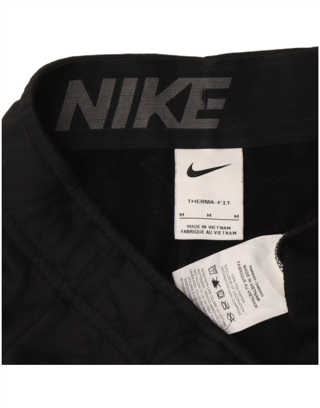 Męskie spodnie dresowe Nike Therma-Fit Graphic, joggery, średnia czerń