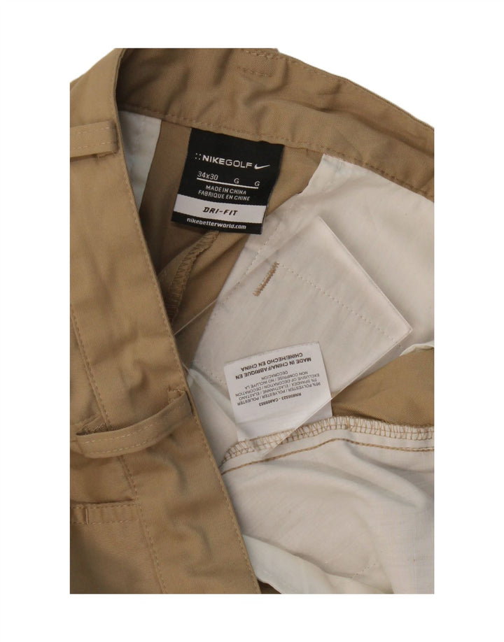 Męskie spodnie typu chino NIKE Dri Fit W34 L30 Beżowy poliester