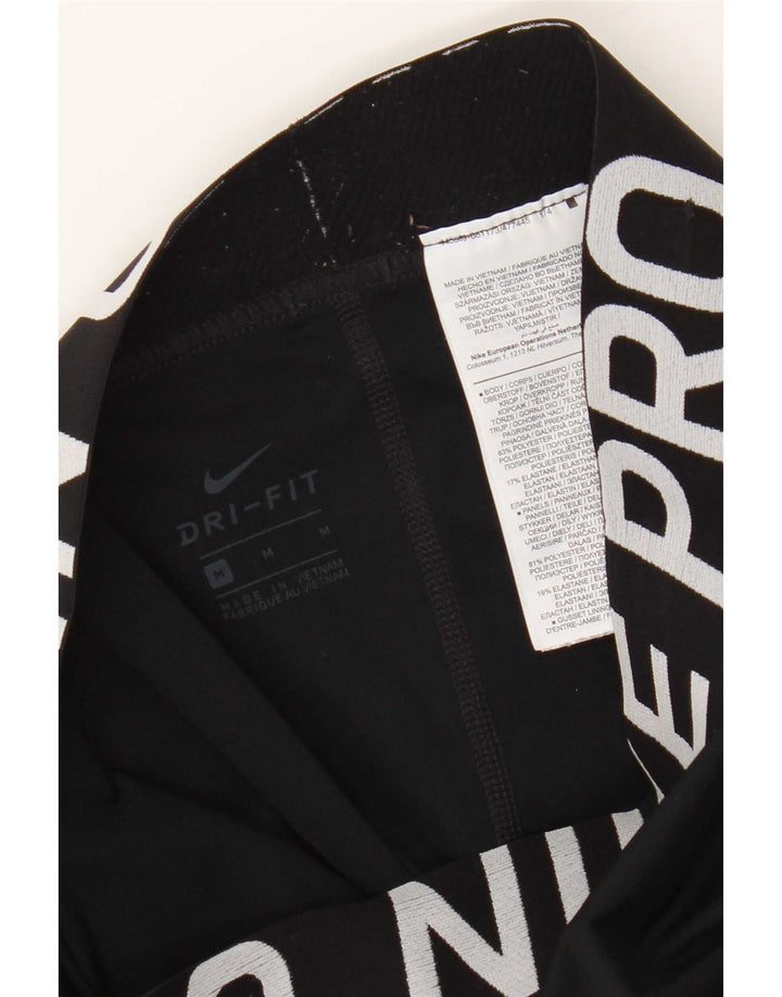 Damskie legginsy Nike Dri Fit Graphic UK 12, średni czarny poliester
