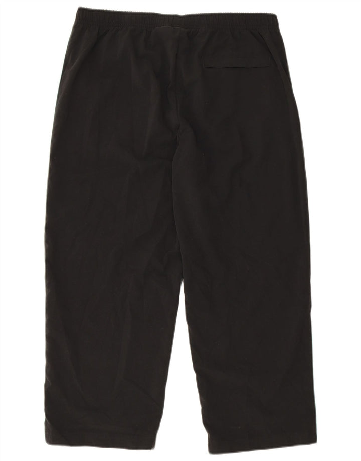 Damskie spodnie dresowe Nike Capri US 12/14, duże czarne bloki kolorów