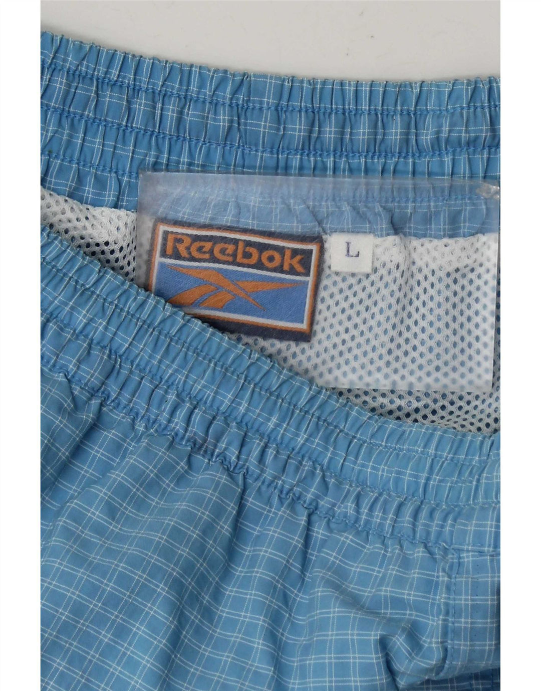 Męskie spodenki sportowe Reebok w dużą niebieską kratkę