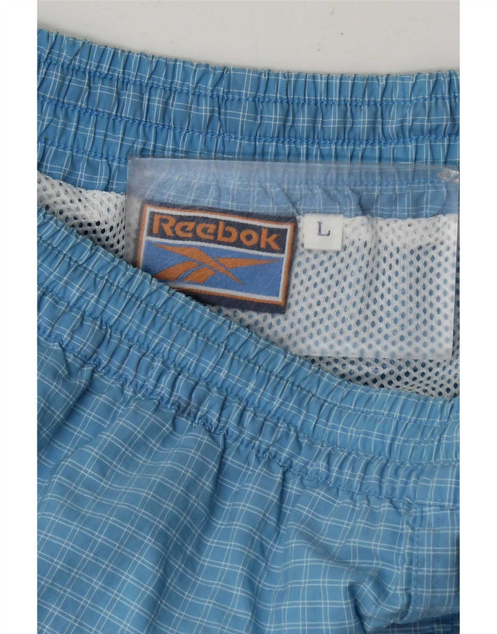Męskie spodenki sportowe Reebok w dużą niebieską kratkę
