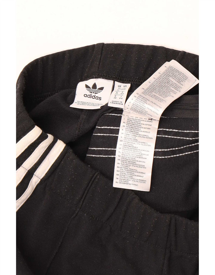 Damskie spodnie dresowe Adidas Flare UK 12 Średni czarny poliester
