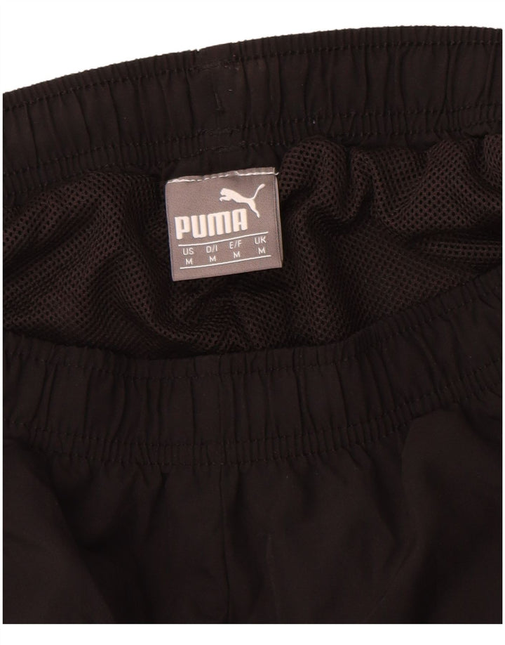 Męskie spodnie dresowe Puma z grafiką, średniej wielkości czarny poliester