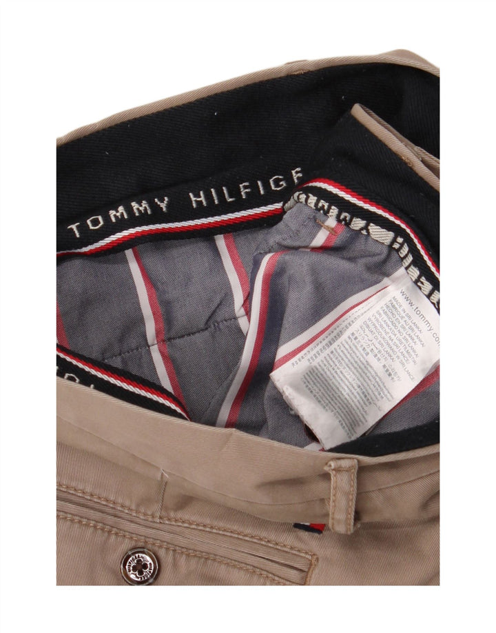 Męskie spodnie typu slim chino TOMMY HILFIGER W34 L33 beżowa bawełna