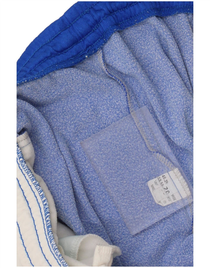 Męskie spodnie dresowe ASICS z grafiką Joggery IT 52 XL Niebieskie bloki kolorów