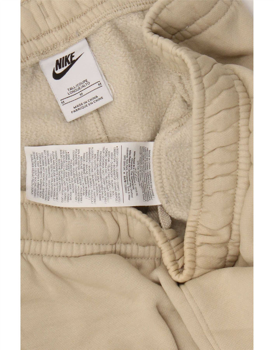 Męskie spodnie dresowe Nike Cargo Joggers w kolorze średniego beżu, bawełny