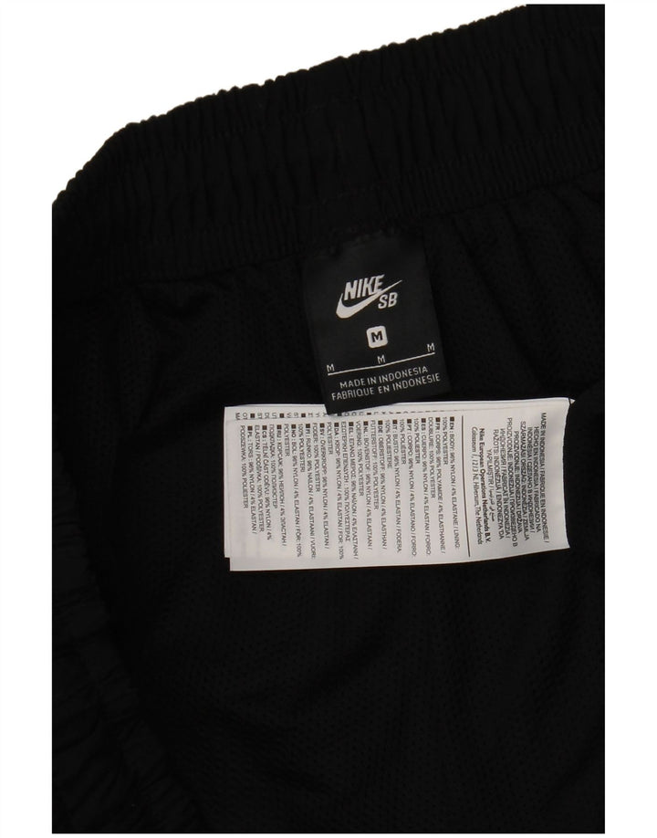 Męskie spodnie dresowe Nike, joggery, średni czarny nylon