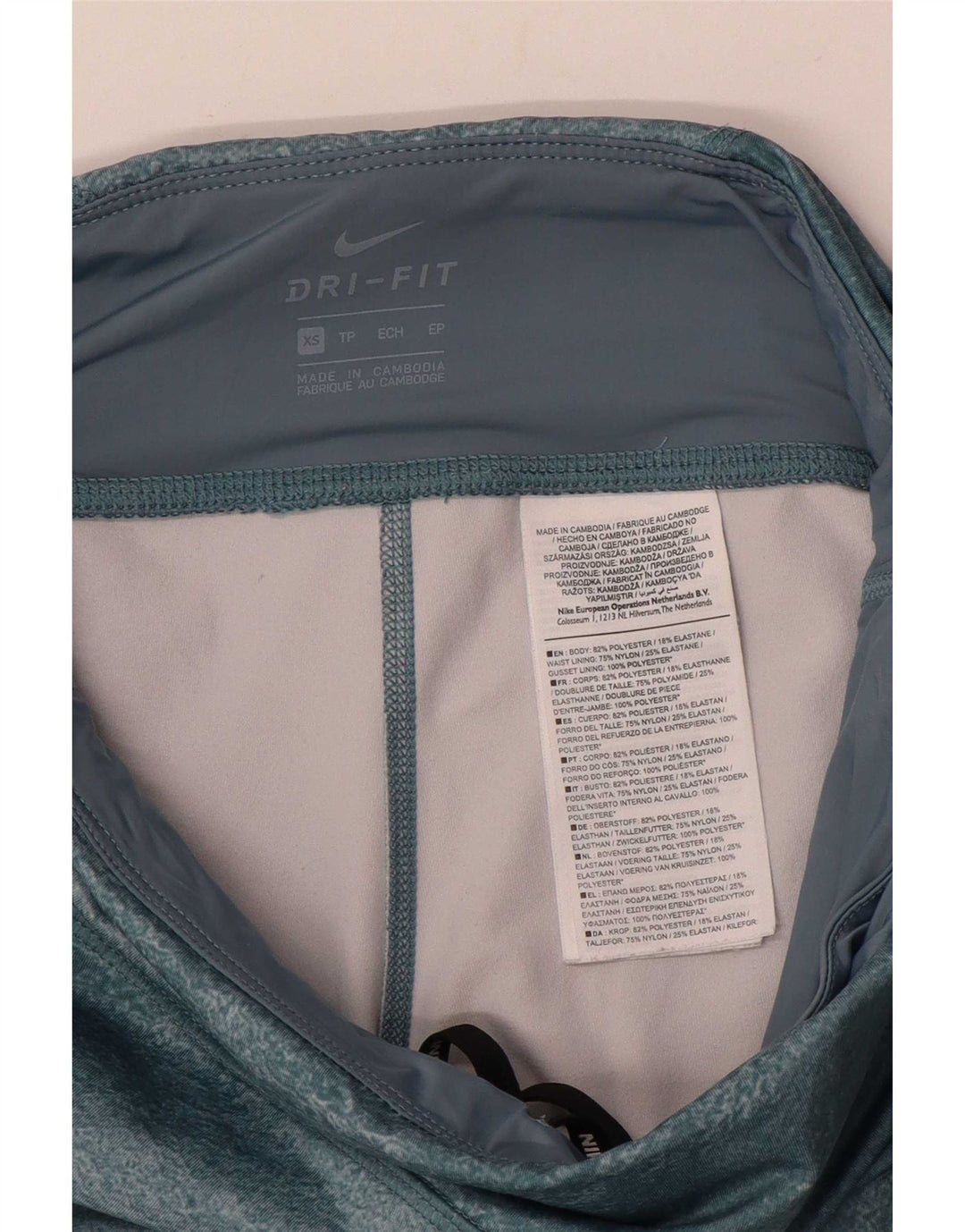 Damskie legginsy Nike Dri Fit UK 6 XS, wielokolorowy poliester z blokami kolorów