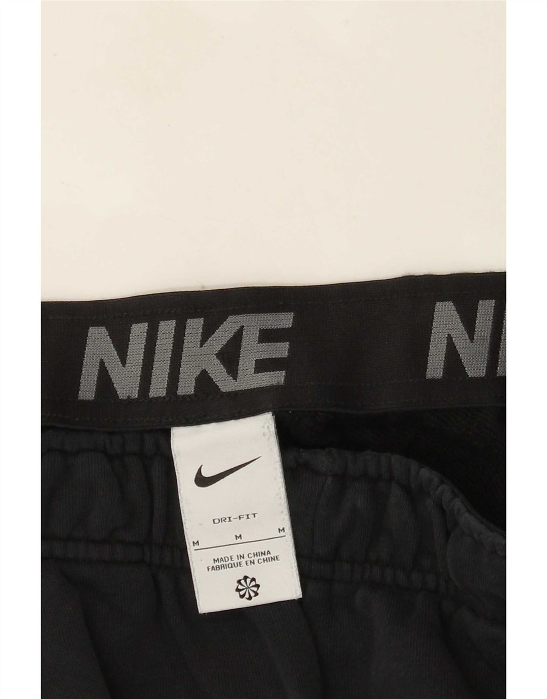 Męskie spodnie dresowe Nike Dri Fit Graphic, średnie czarne