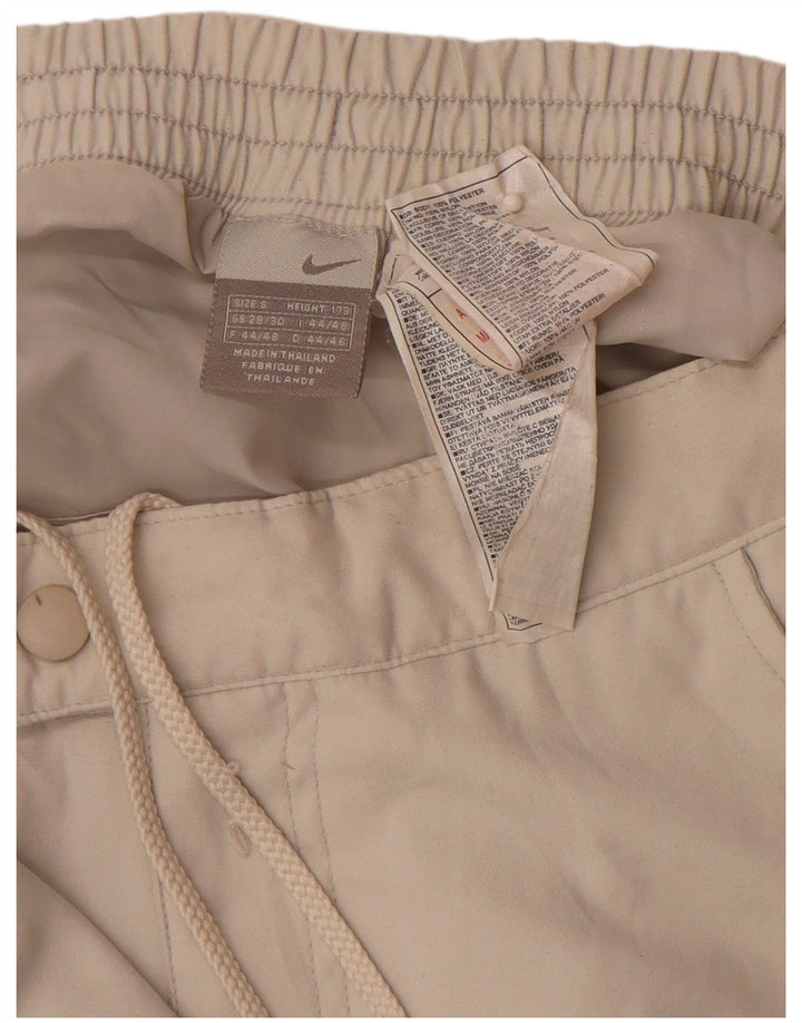 Męskie proste spodnie wiatrówkowe NIKE małe W29 L30 w kolorze beżowym