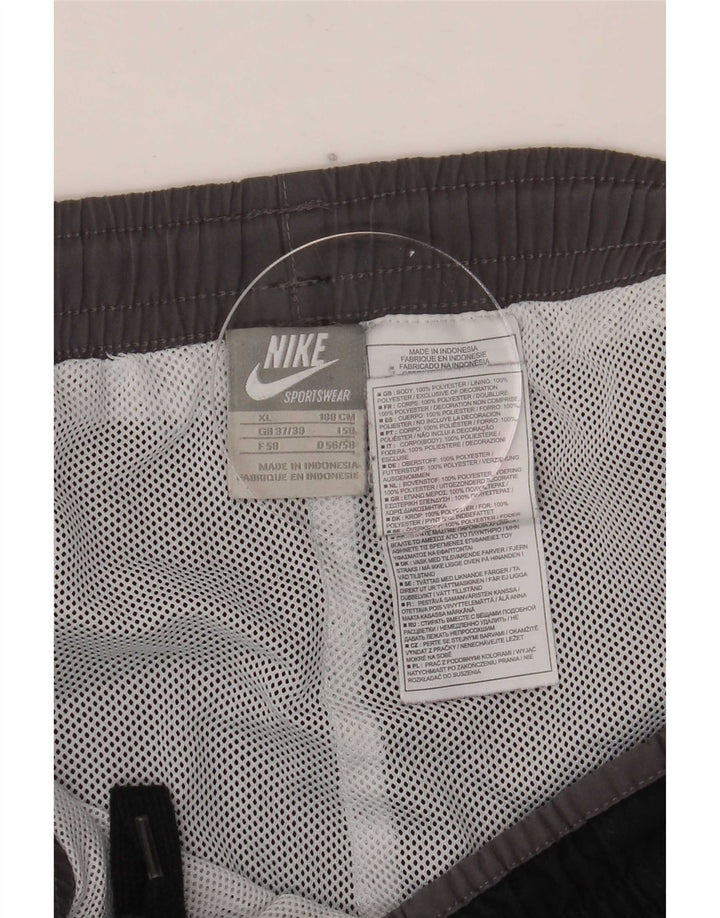Męskie spodnie dresowe Nike Graphic XL, czarne, poliestrowe