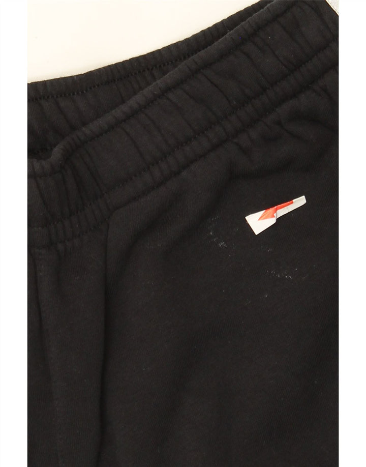 Męskie spodnie dresowe Nike Graphic Tracksuit Joggers w kolorze średniej czerni