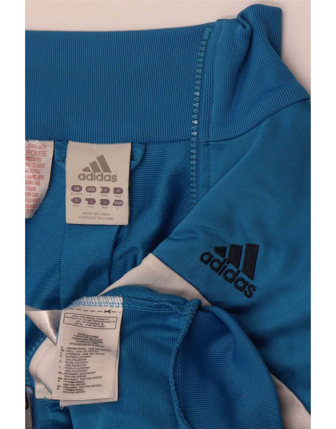 Chłopięca kurtka dresowa Adidas 13-14 lat Niebieski poliester z blokami kolorów