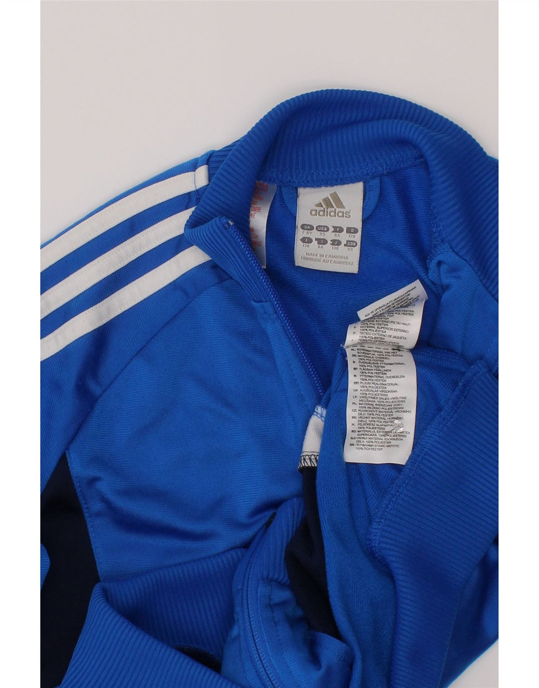 Chłopięca kurtka dresowa Adidas 7-8 lat Niebieski poliester z blokami kolorów
