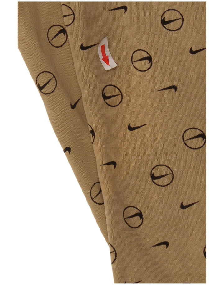Męskie spodnie dresowe Nike z grafiką, małe, beżowe, geometryczne