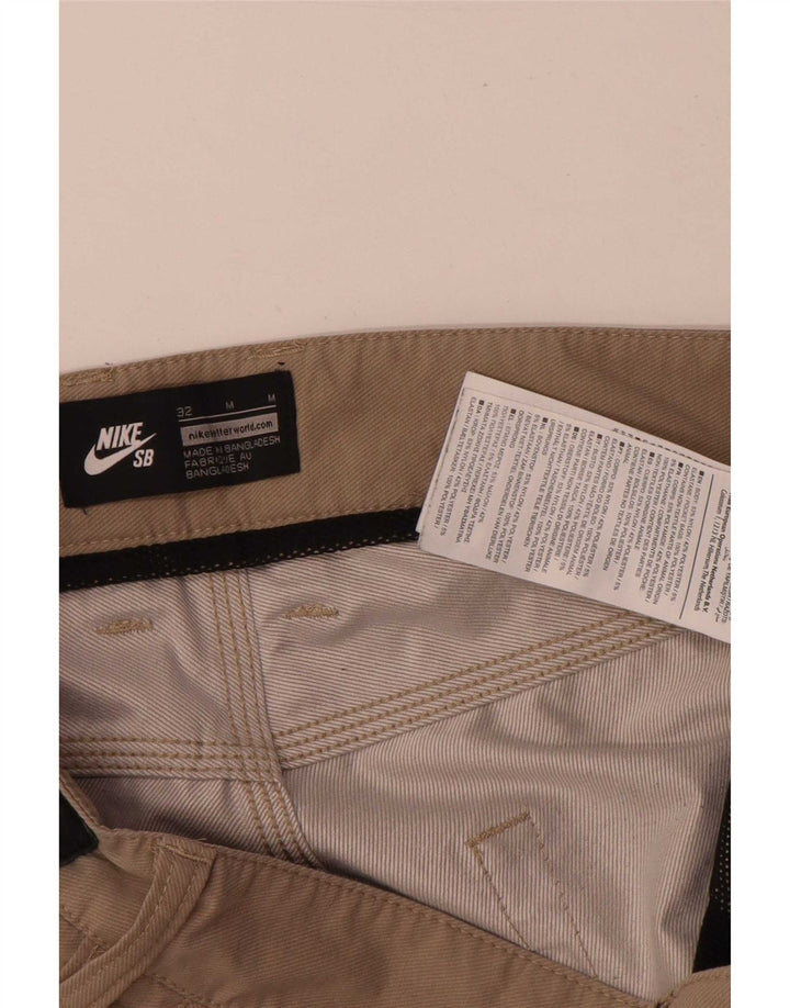 Męskie spodenki na co dzień Nike Regular W32 Średni beżowy nylon