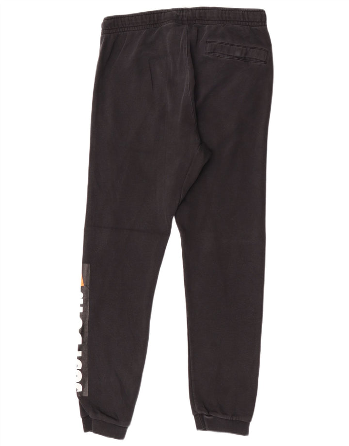 Męskie spodnie dresowe Nike Graphic Joggers, średnia czarna bawełna
