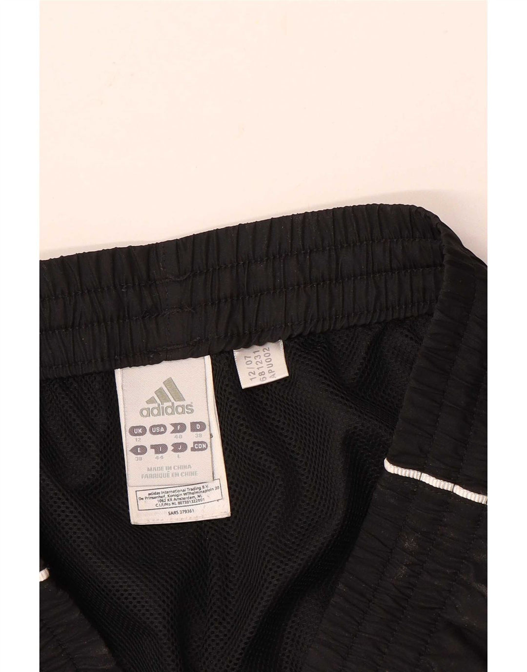 Damskie spodnie dresowe Adidas UK 12, średni czarny poliester