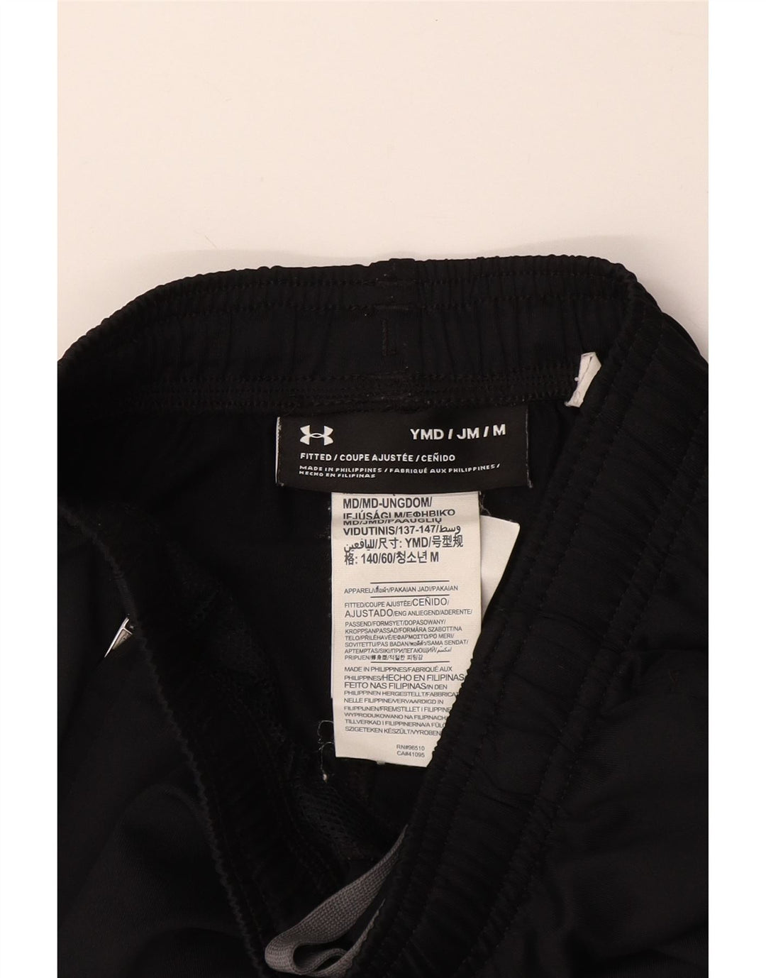 Chłopięce dopasowane spodnie dresowe UNDER ARMOUR 9-10 lat, średnie czarne