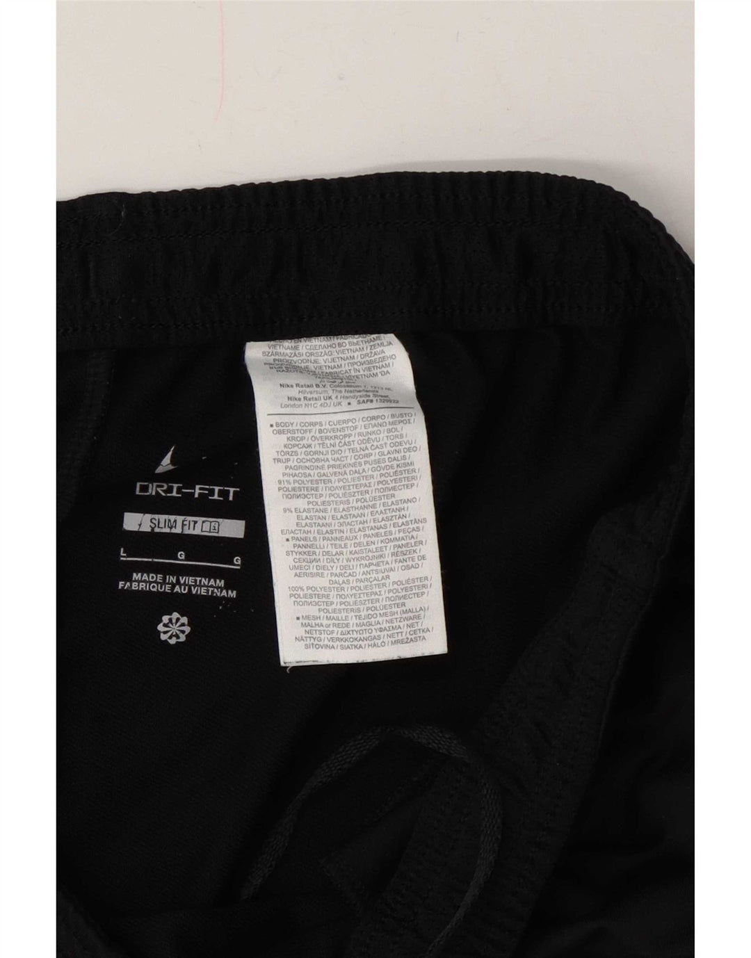 Męskie spodnie dresowe Nike Dri Fit Slim, duży czarny poliester z blokami kolorów