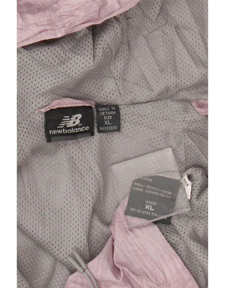 Damska kurtka przeciwdeszczowa z kapturem New Balance UK 18 XL, różowy poliester