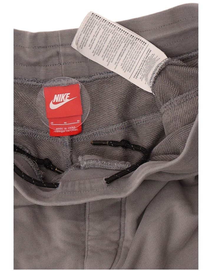 Męskie spodnie dresowe Nike Graphic Dresy Joggery w kolorze średnioszarym