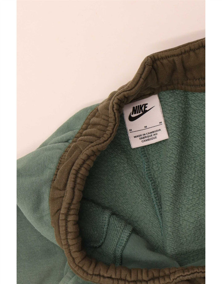 Męskie spodnie dresowe Nike Cargo Joggers w kolorze średniej zieleni