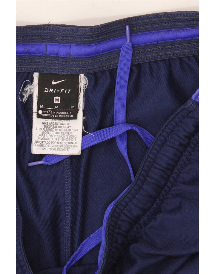 Męskie spodnie dresowe Nike Dri Fit, poliester w kolorze średniego granatu, w blokach kolorów