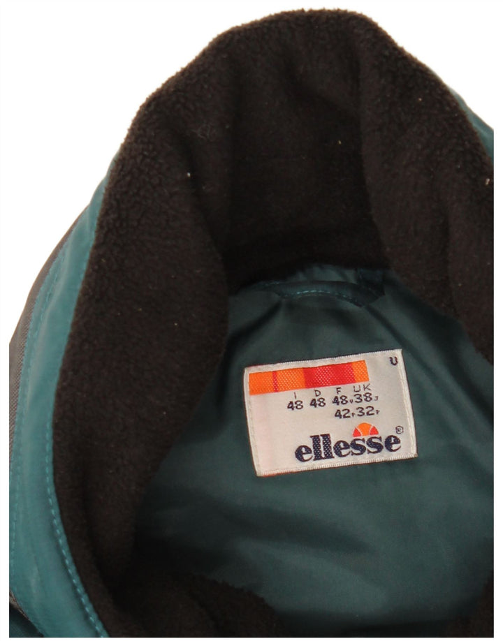 Męska kurtka wiatrówka z kapturem Ellesse UK 38 w kolorze średniej zieleni