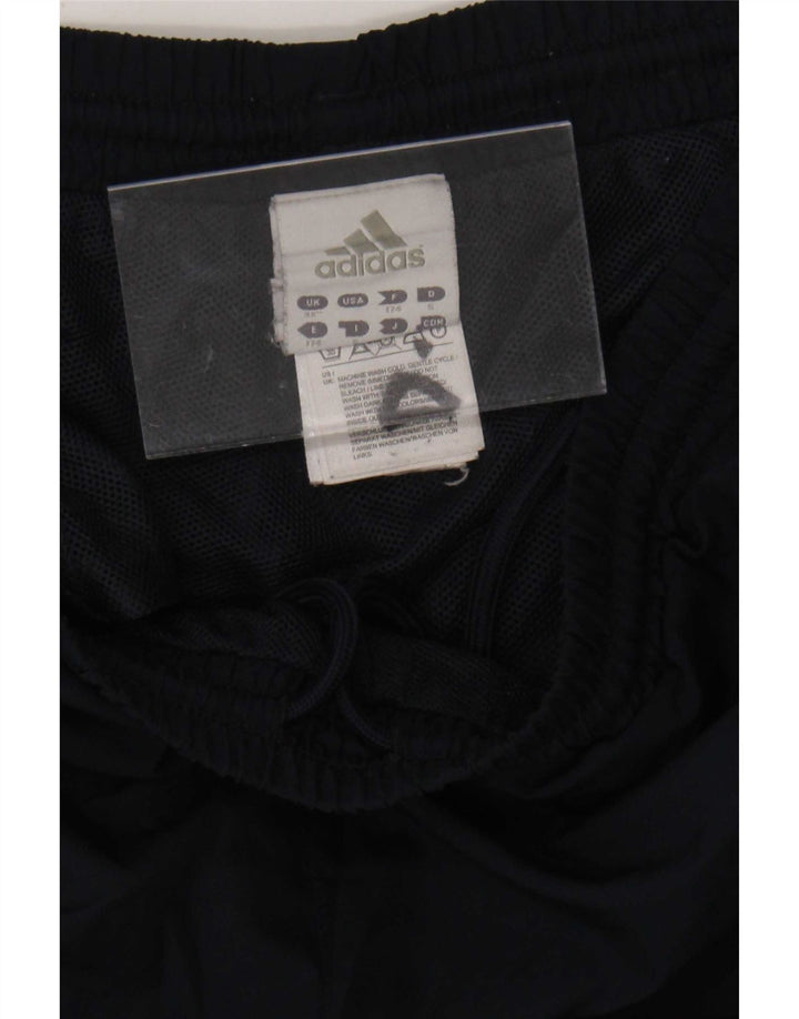 Męskie spodnie dresowe Adidas Capri, średni granatowy, poliester z blokami kolorów